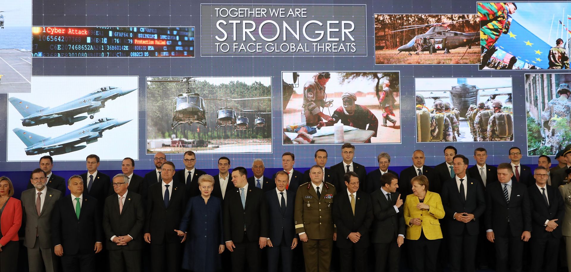 European leaders pose during the launch of the Permanent Structured Cooperation (PESCO), a pact bringing together 25 EU governments to jointly fund, develop and deploy armed forces.