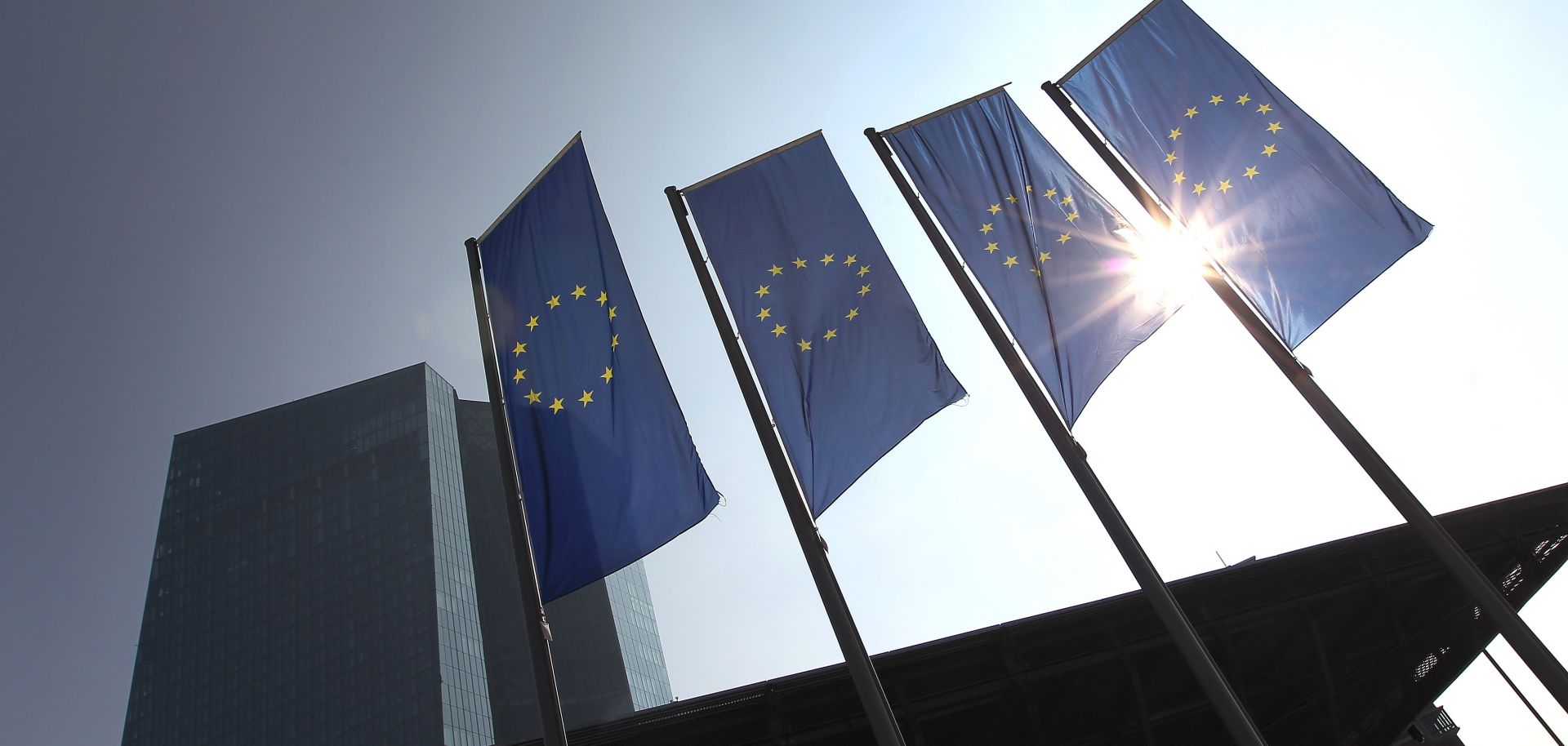 Banners of the European Union fly outside the European Central Bank headquarters in Frankfurt, Germany.