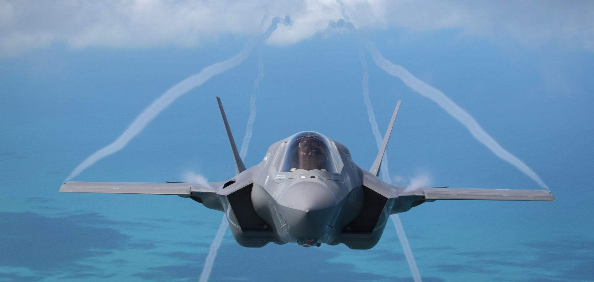 An F-35B aircraft approaches a KC-130J Super Hercules aircraft to refuel in 2016.