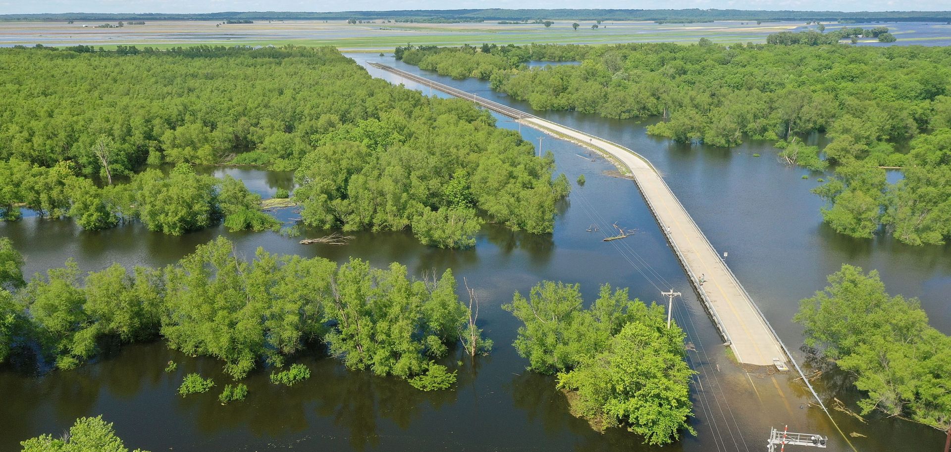 Floodwater from the Mississippi River cuts off the roadway from Missouri into Illinois.