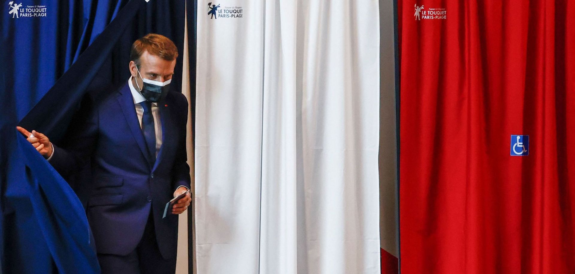 French President Emmanuel Macron leaves the polling booth after voting June 20, 2021, in Le Touquet, France.