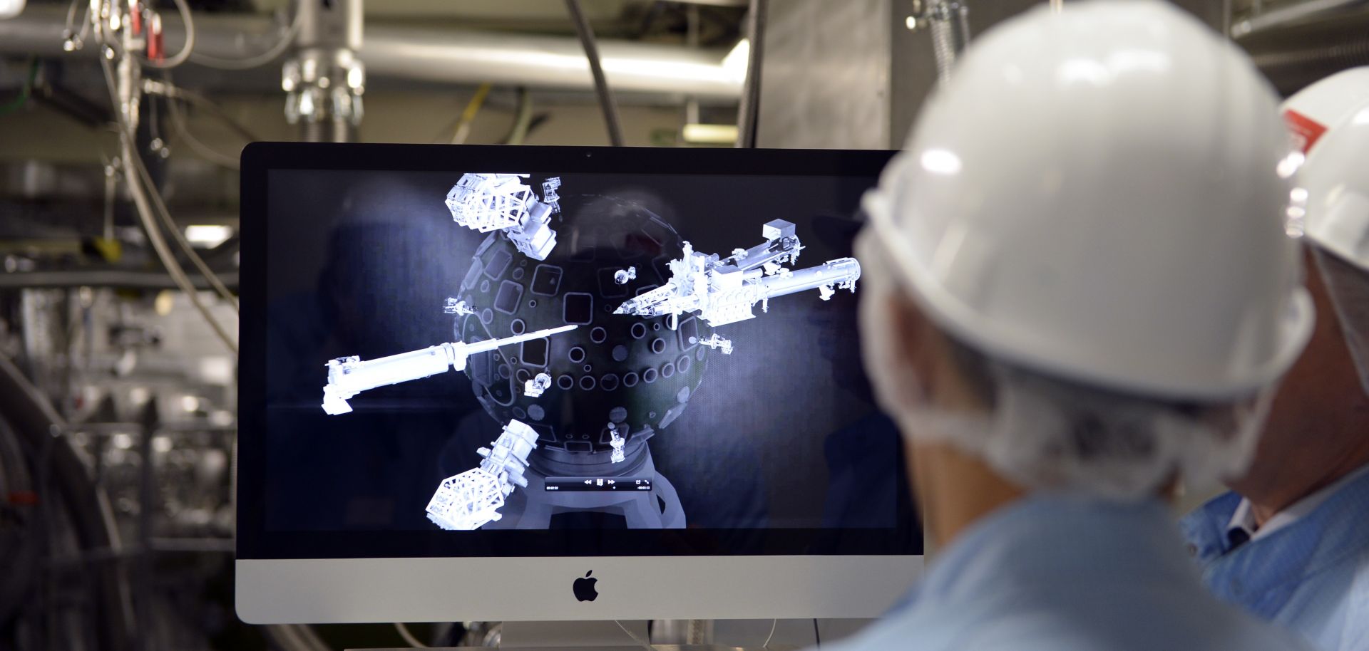 Workers look at a computer screen at France's Center for Scientific and Technical Study of Aquitaine, which is dedicated to the design of nuclear weapons. 