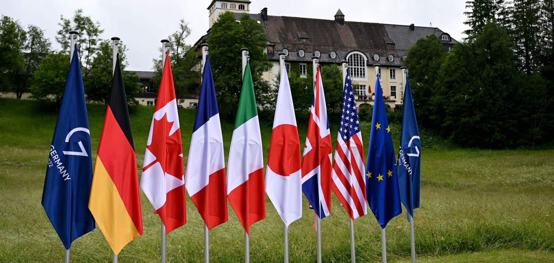 The flags of the G-7 countries and the European Union are seen on June 28, 2022, in front of Elmau Castle in southern Germany during this year's G-7 Summit.