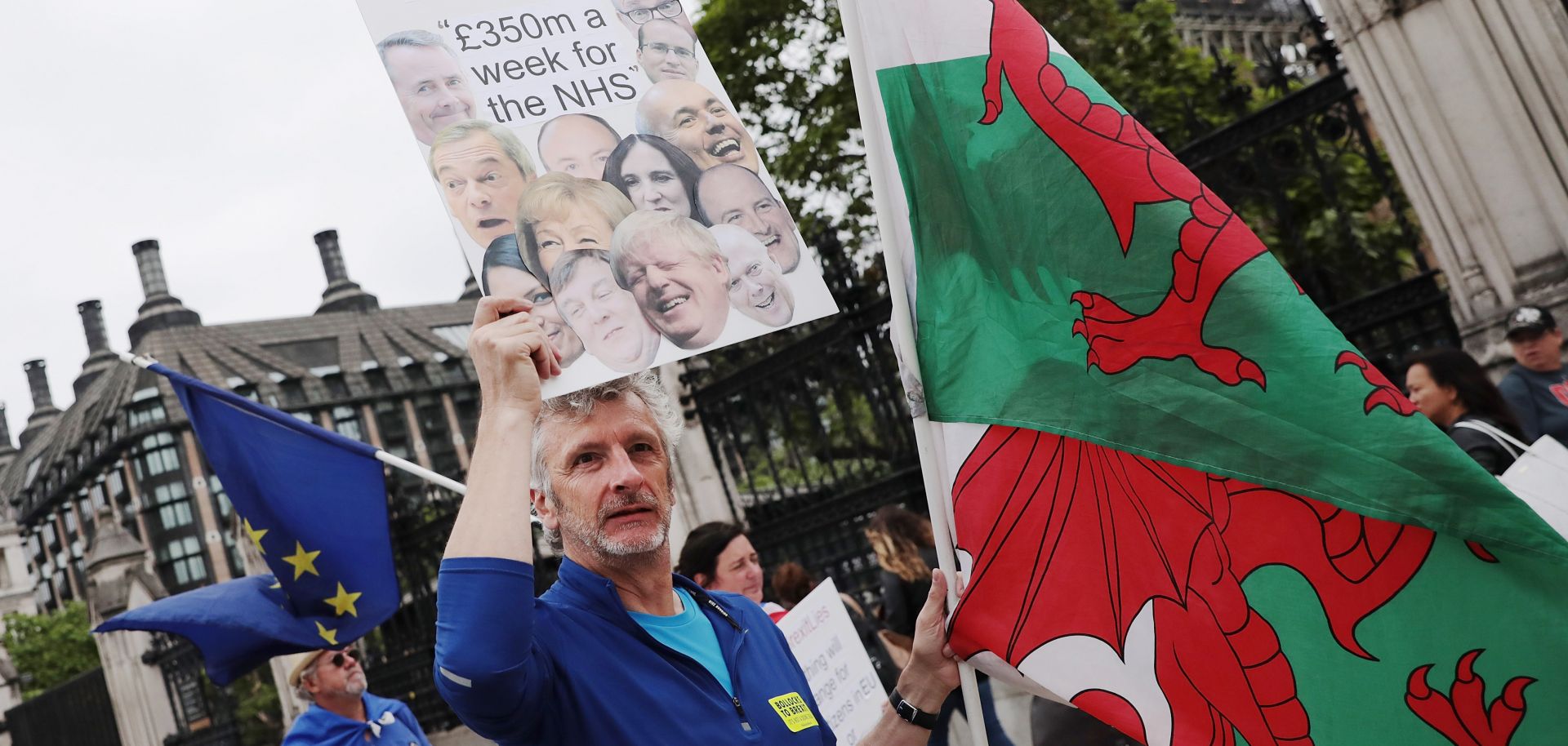 An anti-Brexit demonstrator stands outside the Houses of Parliament.