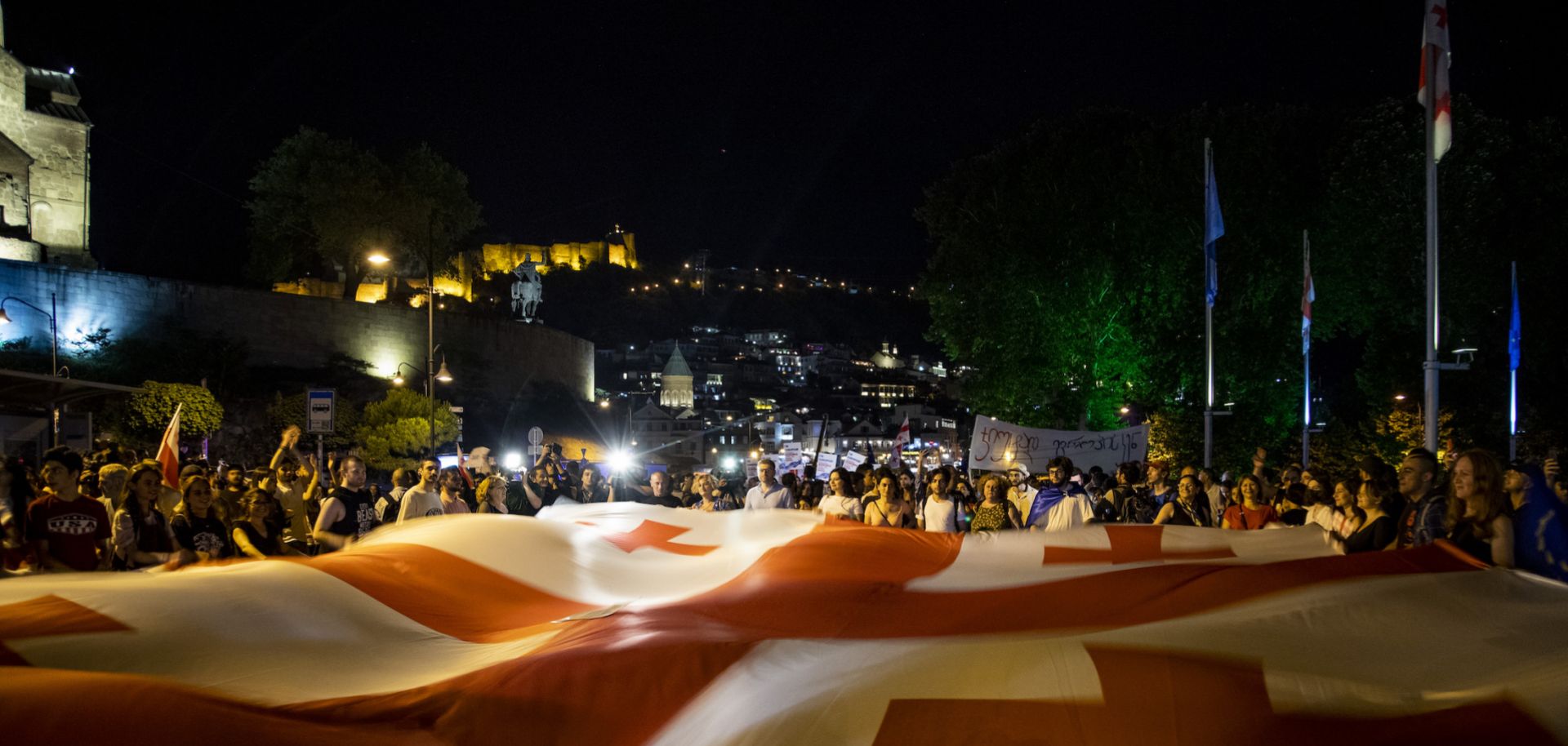Demonstrators wave a flag of Georgia in Europe Square on June 20, 2022 in Tbilisi, Georgia.