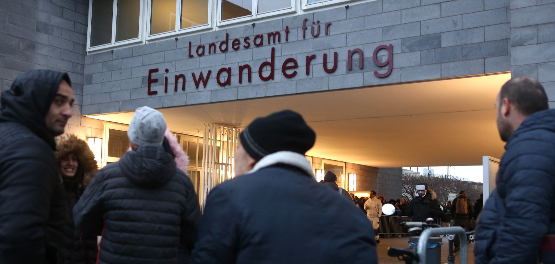 Foreigners wait outside the immigration office in Berlin, Germany, for assistance in regulating their legal residency status on Feb. 6, 2020.