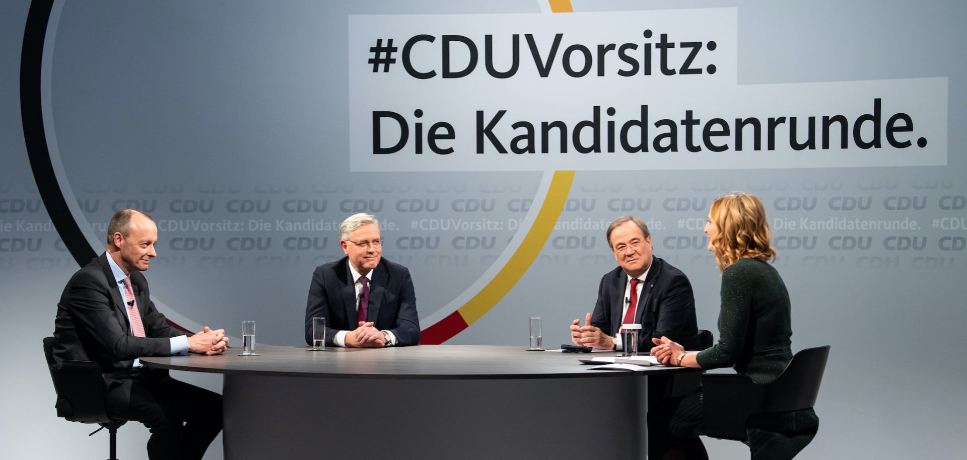 German journalist Tanja Samrotzki (right) moderates a panel with the candidates vying for the leadership post of Chancellor Angela Merkel’s Christian Democratic Union (CDU) party -- Friedrich Merz, Norbert Roettgen and Armin Laschet (from left to right) -- on Dec. 14, 2020, in Berlin, Germany.