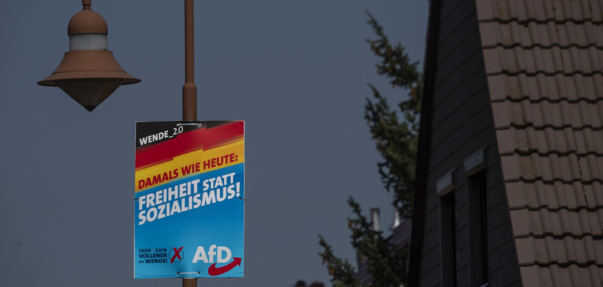 A campaign poster for the far-right Alternative for Germany (AfD) reads "Freedom instead of socialism" in Krewelin, Brandenburg, ahead of state elections on Sept. 1, 2019.