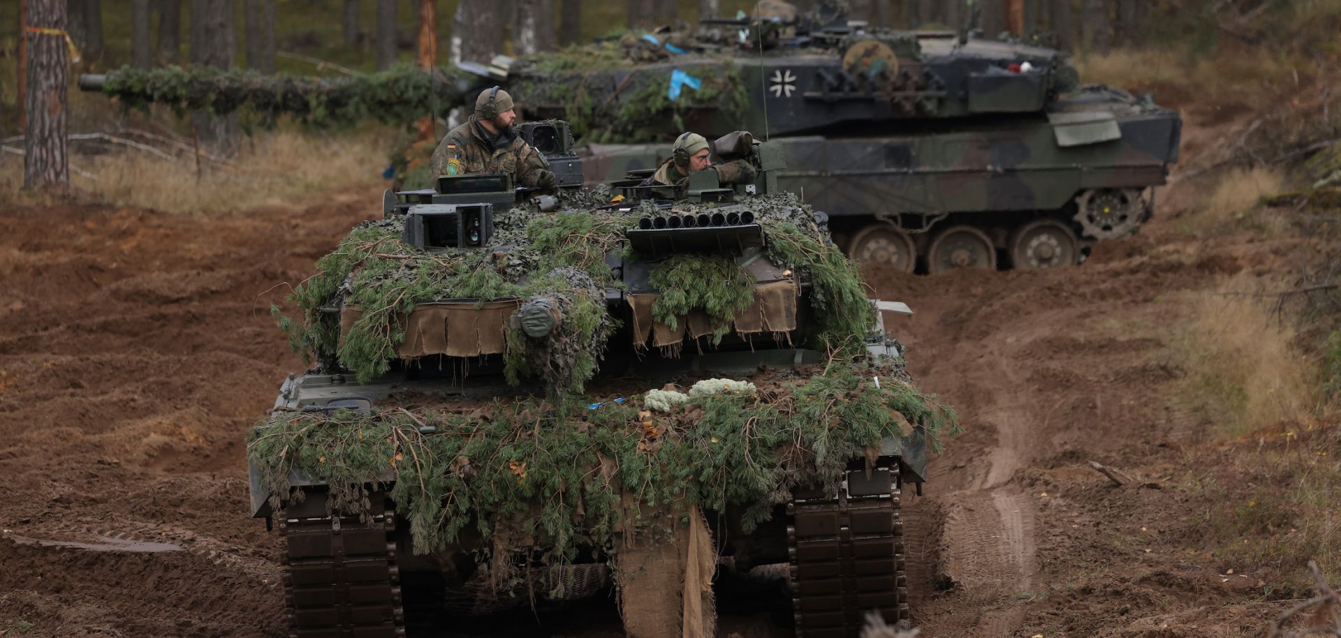 Two Leopard 2A6 main battle tanks of the German armed forces participate in the NATO Iron Wolf military exercises on Oct. 27, 2022, in Pabrade, Lithuania. 