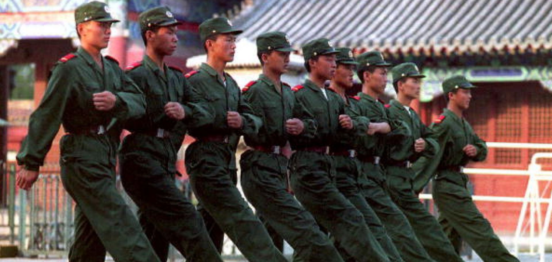 People's Liberation Army troops march near their Tiananmen Square barracks in 1993, four years after the suppression of protesters.