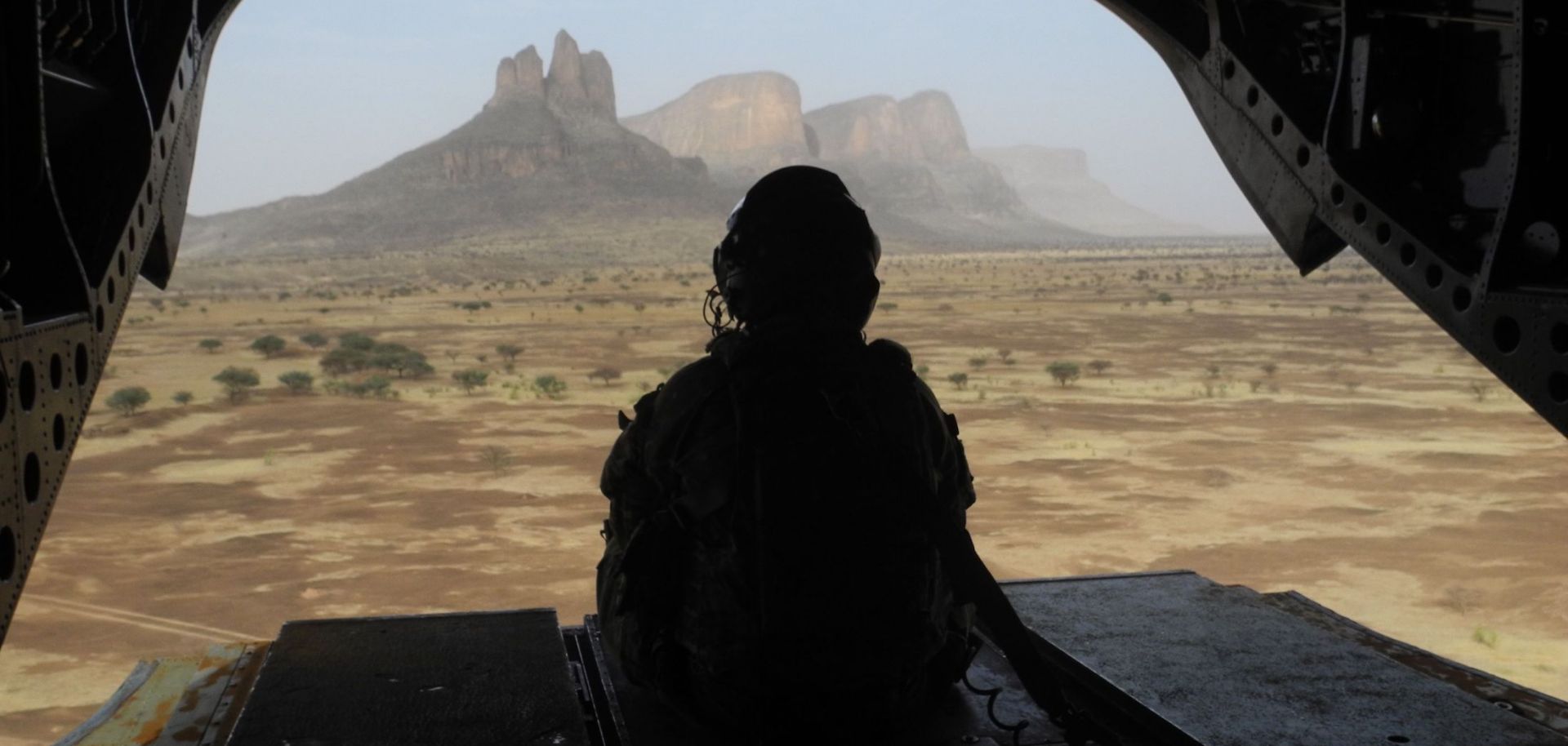 A British soldier leaves the Hombori area aboard a Chinook helicopter on March 28, 2019, during the start of the French Barkhane Force operation in Mali's Gourma region. 