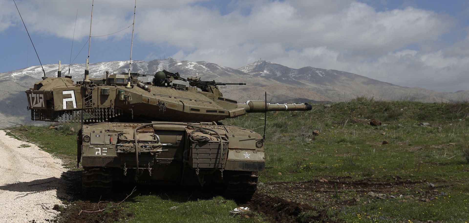 An Israeli army tank is stationed near the village of Majdal Shams, in the Israeli-annexed Golan Heights, on March 19, 2014.