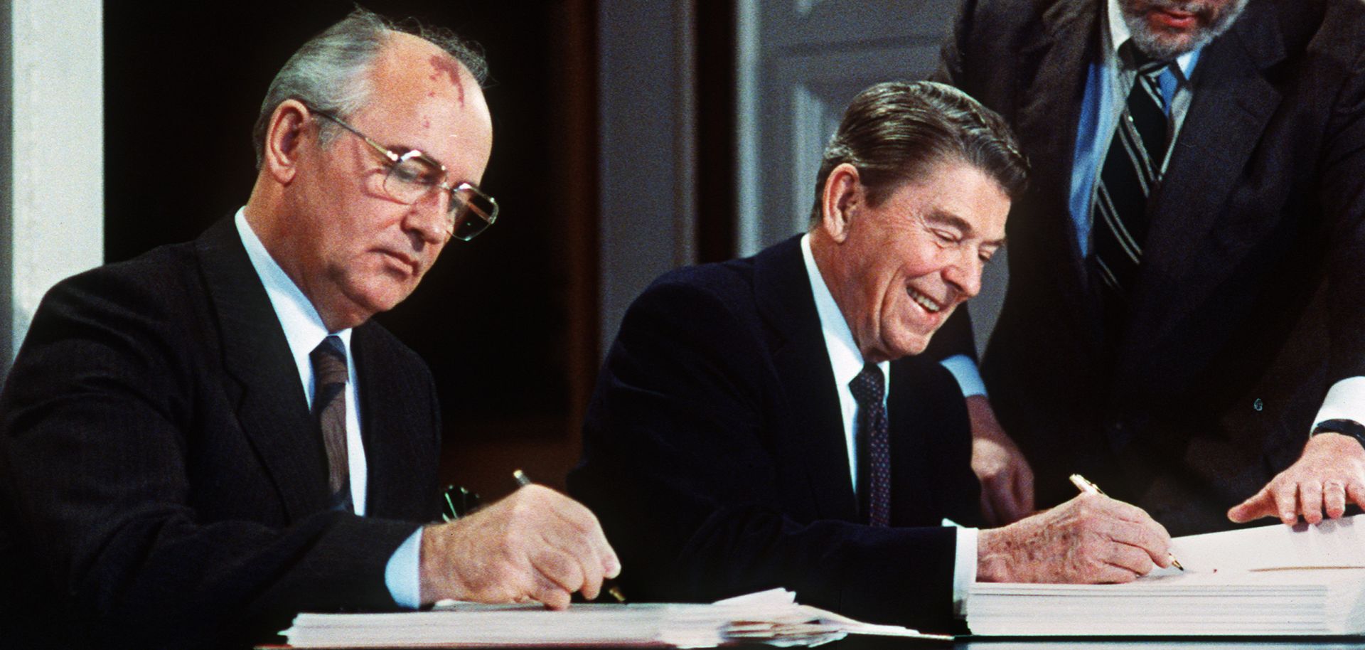 Soviet leader Mikhail Gorbachev (L) and U.S. President Ronald Reagan sign the Intermediate-Range Nuclear Forces Treaty in December 1987.