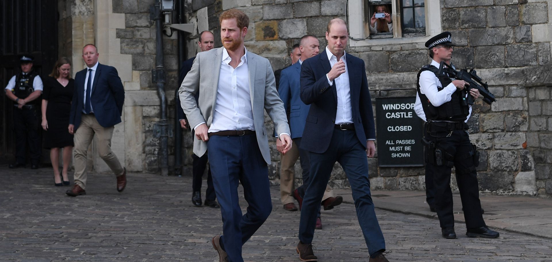 Prince Harry and Prince William, Duke of Cambridge, embark on a walkabout ahead of the royal wedding of Prince Harry and Meghan Markle on May 19, Windsor, England. 
