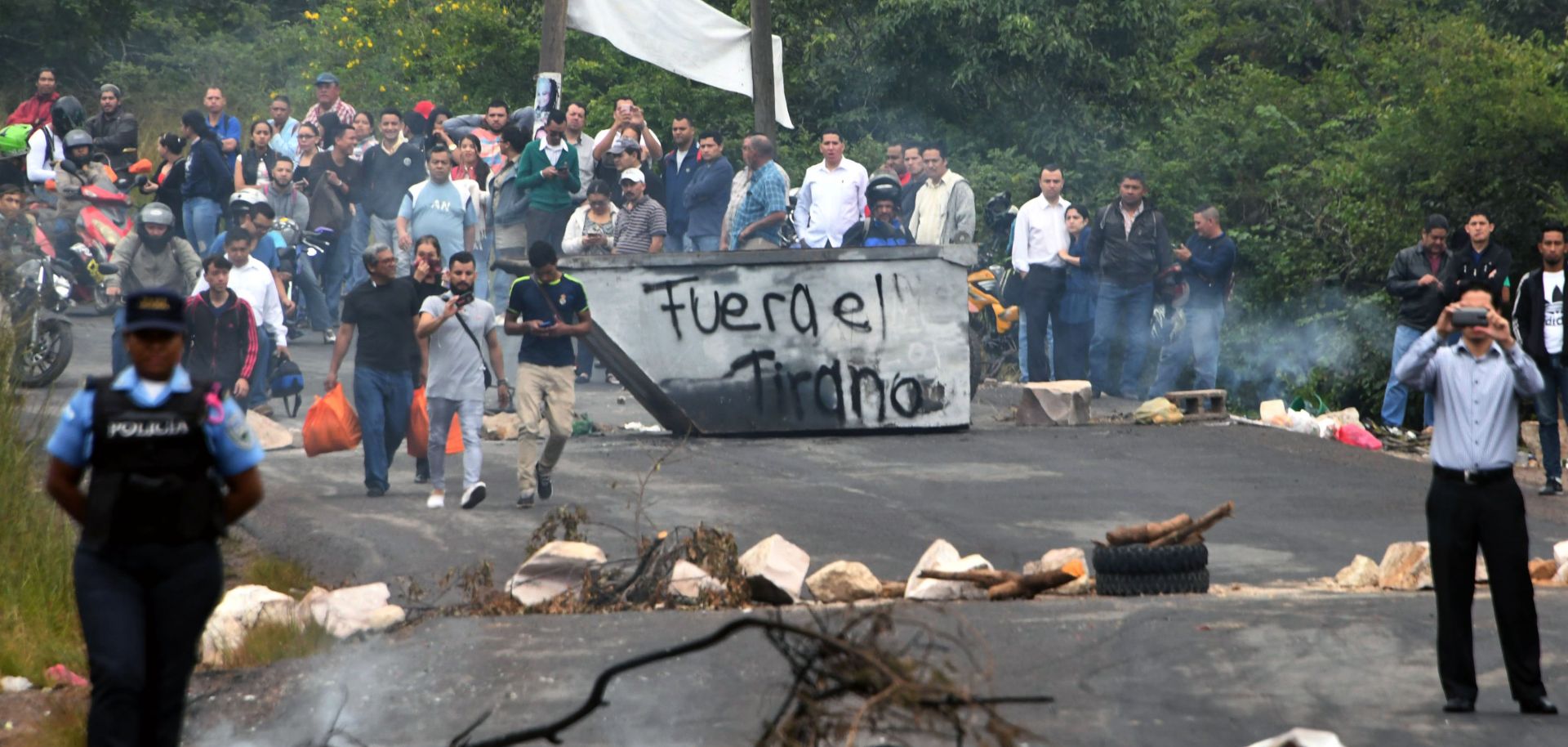 Supporters of Honduran presidential candidate Salvador Nasralla set up a barricade blocking access too the country's capital. 