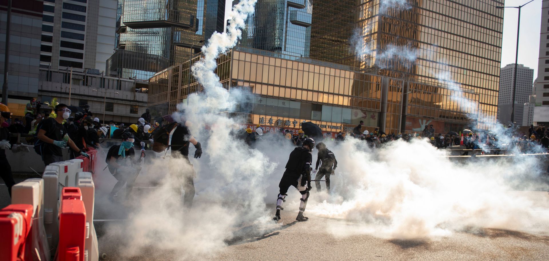 Protesters fleeing tear gas during a general strike in Hong Kong in August 2019.