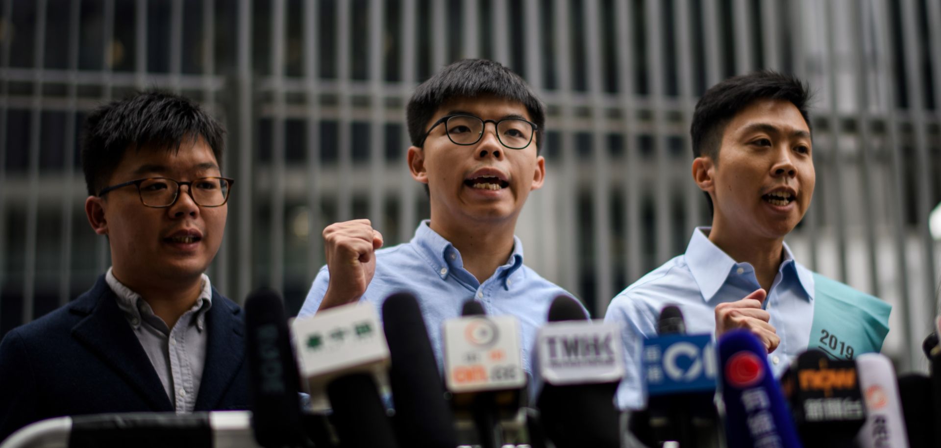This photo shows Hong Kong pro-democracy activists Joshua Wong and Kelvin Lam protesting in front of the Legislative Council building after Wong was disqualified from running in district council elections.