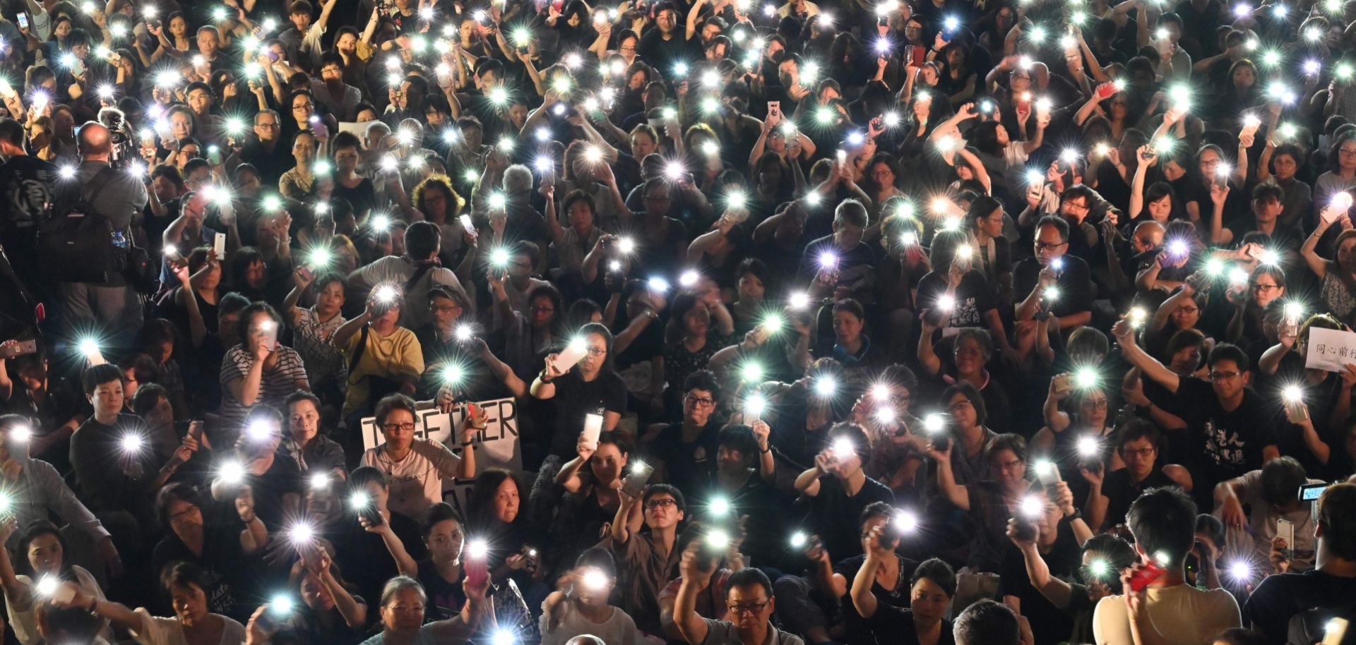 Protesters hold up their lighted phones during a July 5, 2019, rally in Hong Kong.
