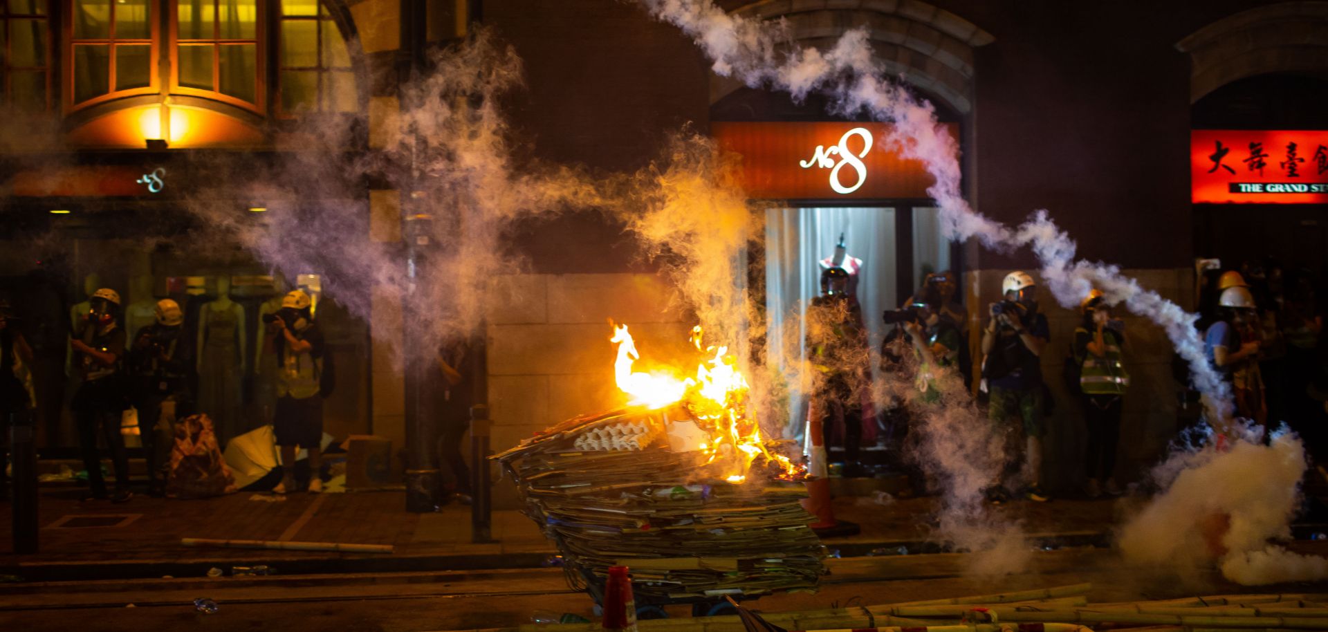 A burning cart is seen during a demonstration in the area of Sheung Wan on July 28, 2019, in Hong Kong. 