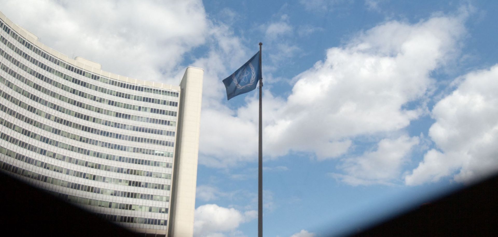 The flag of the International Atomic Energy Agency (IAEA) flutters in front of the IAEA building in Vienna, Austria, on July 10, 2019.