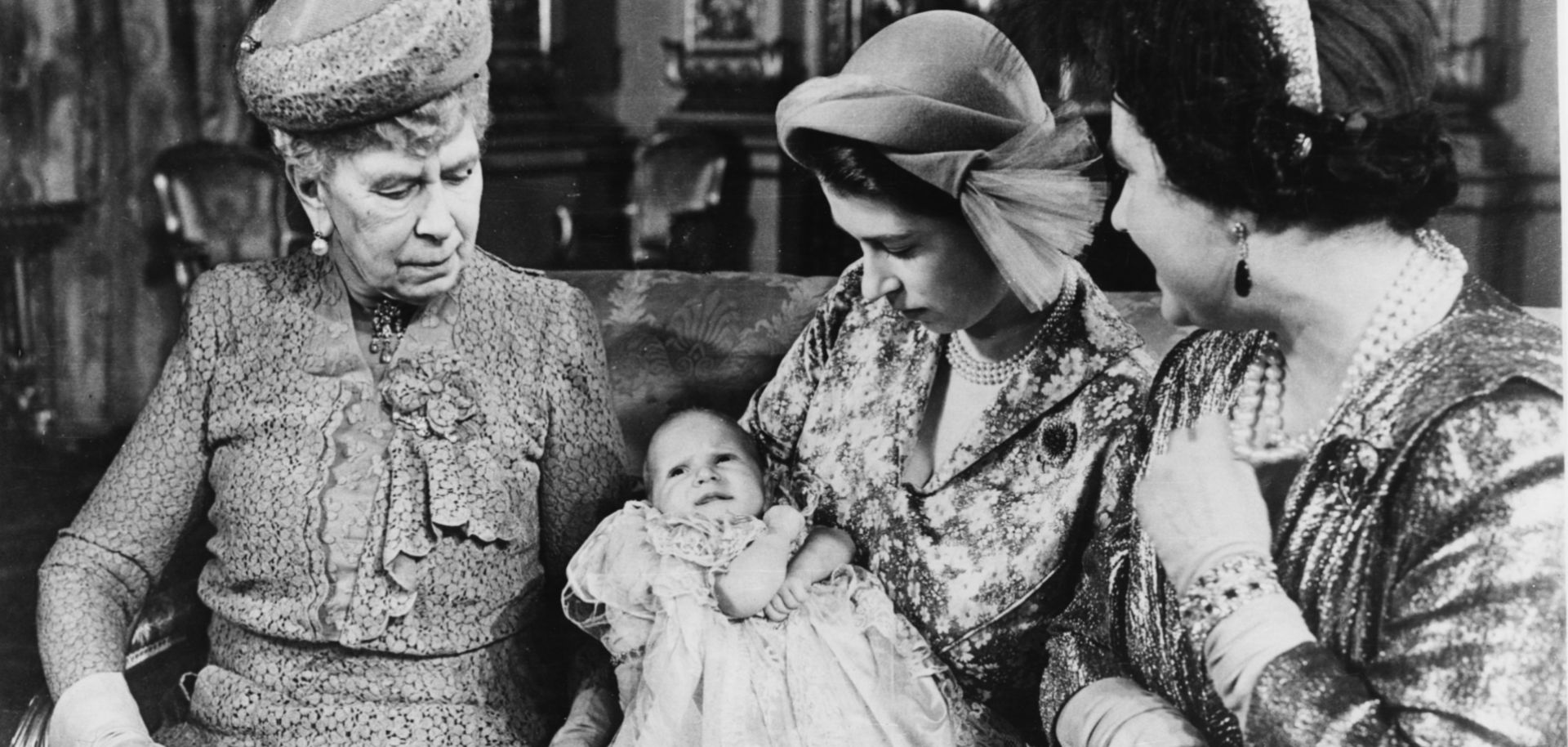 Princess Elizabeth (later Queen Elizabeth II) holds her daughter, Princess Anne, at Anne's christening in Buckingham Palace on Oct. 21, 1950. Elizabeth's grandmother, Queen Mary, left, and her mother, Queen Elizabeth are also pictured.