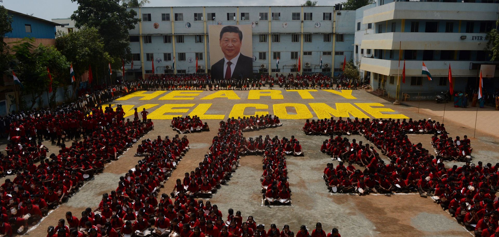 Indian students form the Chinese character for the name of Chinese President Xi Jinping, in Chennai on Oct. 10, 2019, ahead of a summit between Xi and his Indian counterpart, Narendra Modi.