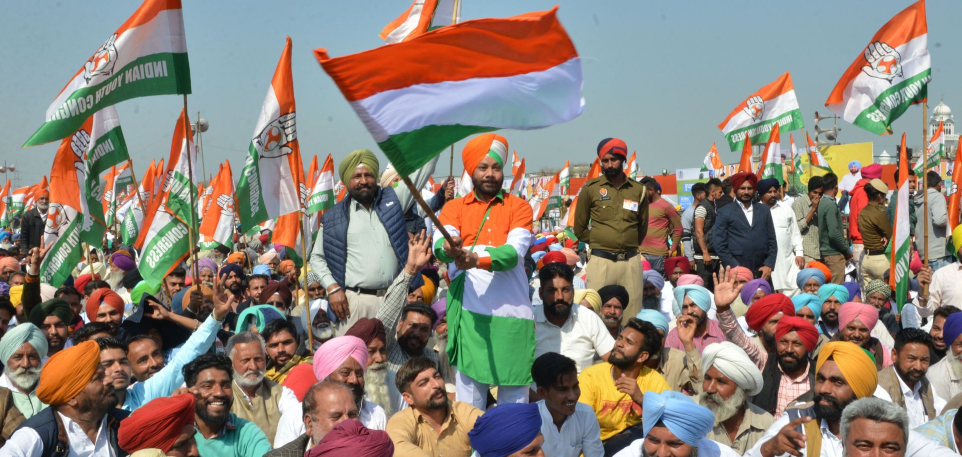Supporters hold up flags in support of the Indian National Congress (INC) party during the launch of the party's campaign in Punjab ahead of India’s upcoming  elections.