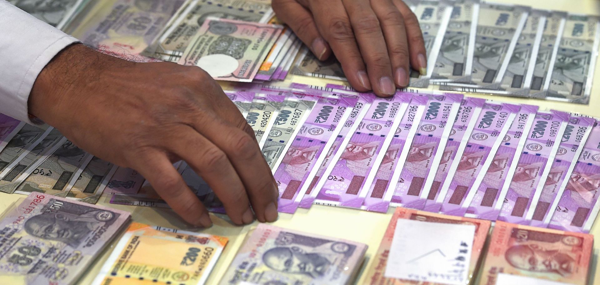 A numismatist in India displays bank notes at an exhibition in Mumbai in late 2017.