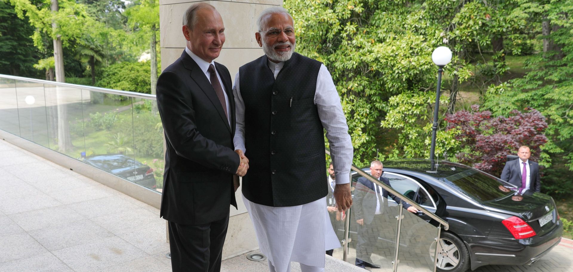 Russian President Vladimir Putin (left) welcomes Indian Prime Minister Narendra Modi during a meeting in Sochi on May 21.