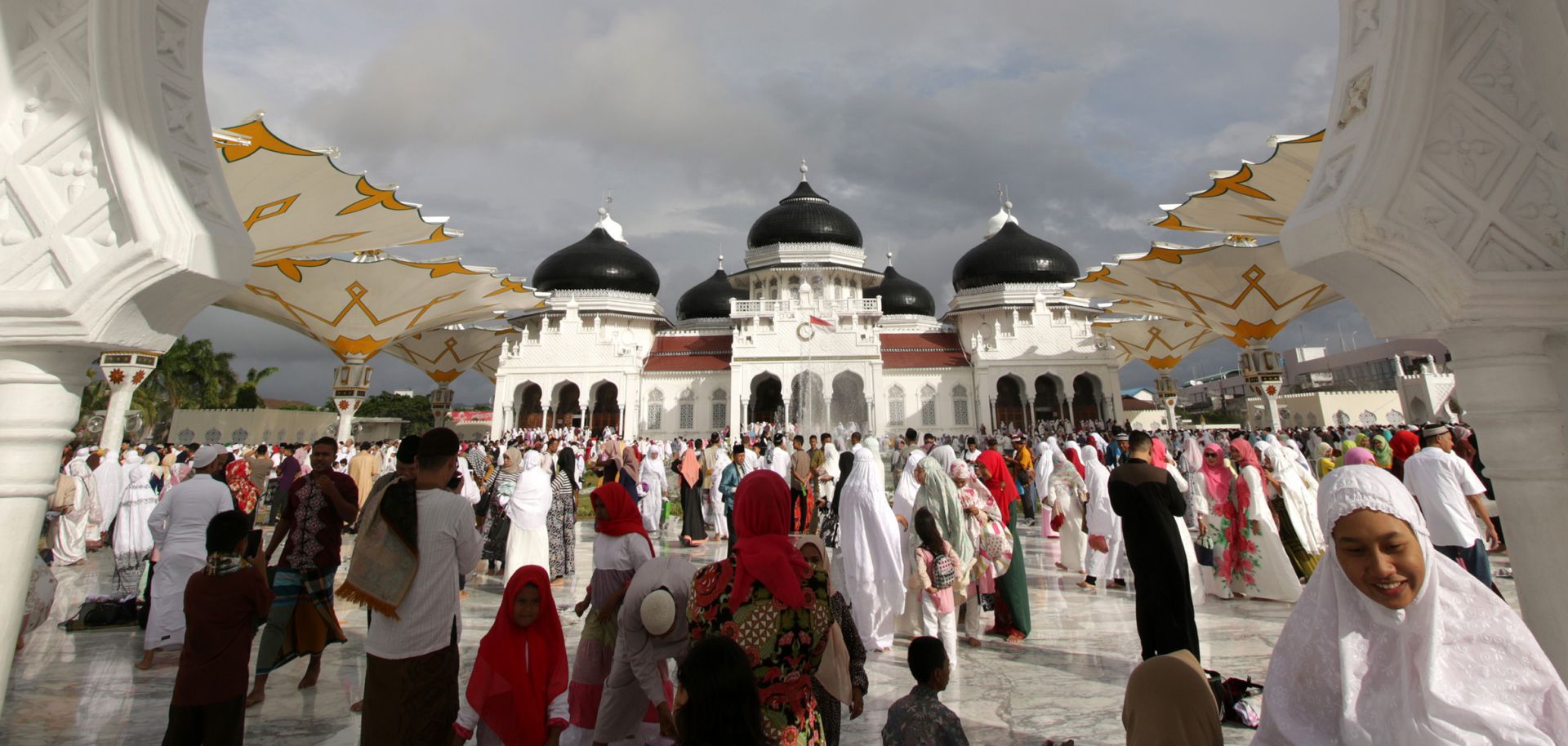 Indonesian Muslims offer Eid al-Fitr prayers at a mosque in Banda Aceh. Over the next two years, President Joko "Jokowi" Widodo will need political acumen to counter the opposition's appeal to Islamist sentiment to keep his ruling coalition together.