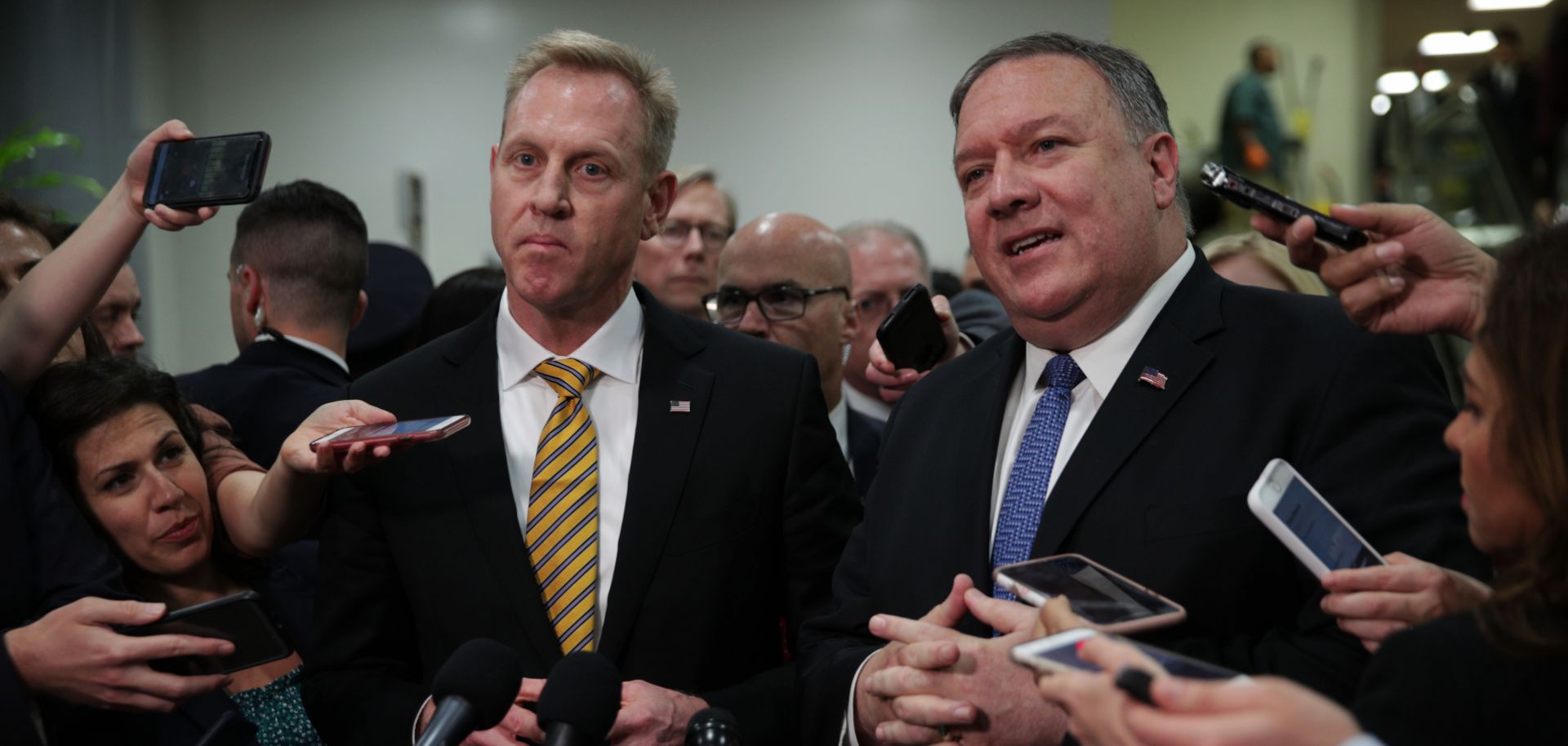 U.S. Secretary of State Mike Pompeo, right, and Acting Defense Secretary Patrick Shanahan talk with reporters after briefing members of Congress about Iran on May 21, 2019.