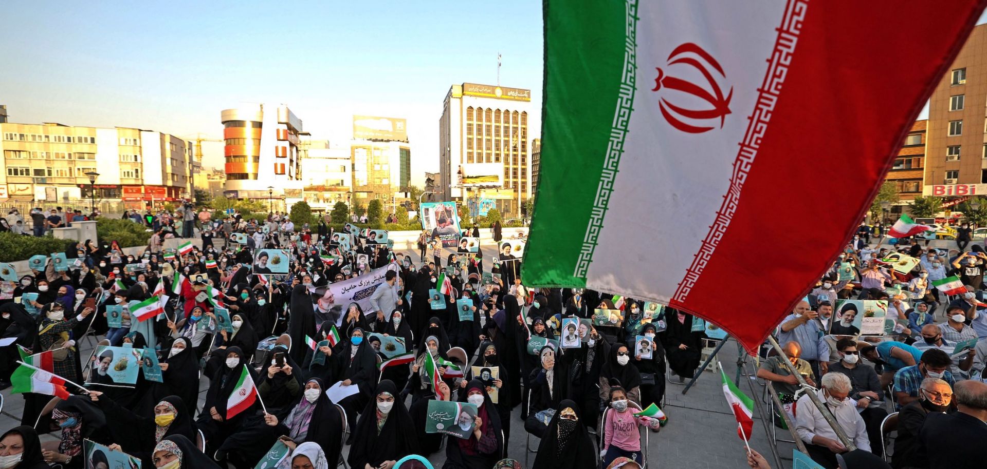 Supporters of Iranian presidential candidate Ebrahim Raisi attend an election campaign June 14, 2021 in Tehran.