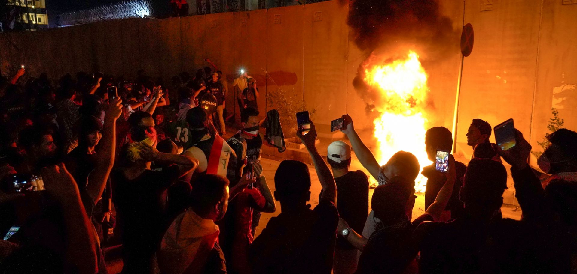 Protesters, some burning tires, surround the Iranian Consulate in Karbala, Iraq, on Nov. 3, 2019. Iranian influence in Iraq and its network of militia proxies have been a key complaint of the demonstrators.