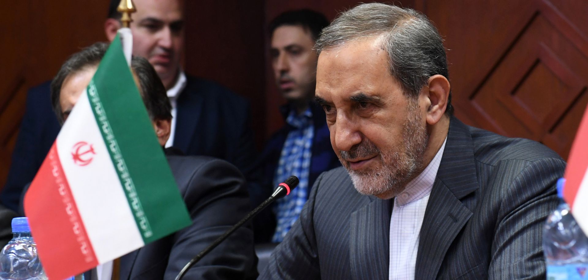 Iranian Supreme Leader Ayatollah Ali Khamenei's chief foreign policy adviser, Ali Akbar Velayati, oversees an agreement between the University of Aleppo in Syria and Iran's Islamic Azad University in November 2017. Syria is a key component in Iran's foreign policy strategy to extend its influence across the Arab world.