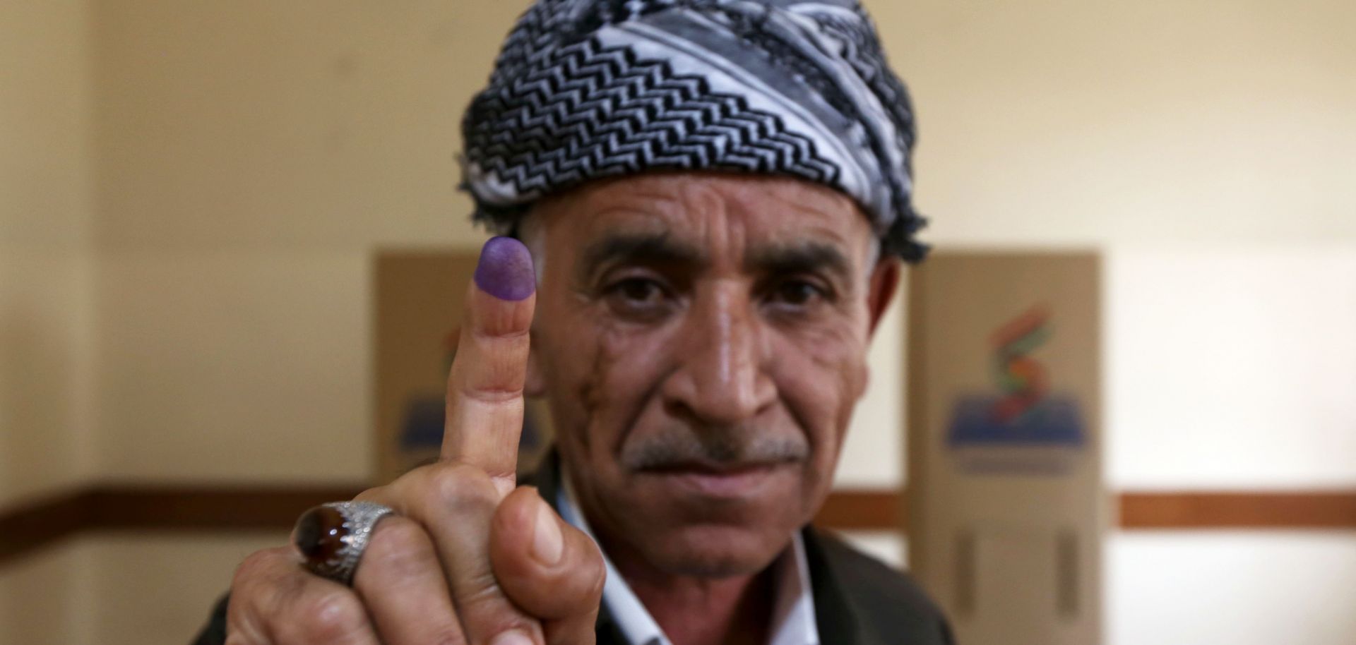An man shows his ink-stained finger after voting in Iraqi Kurdistan's independence referendum in Arbil on Sept. 25.