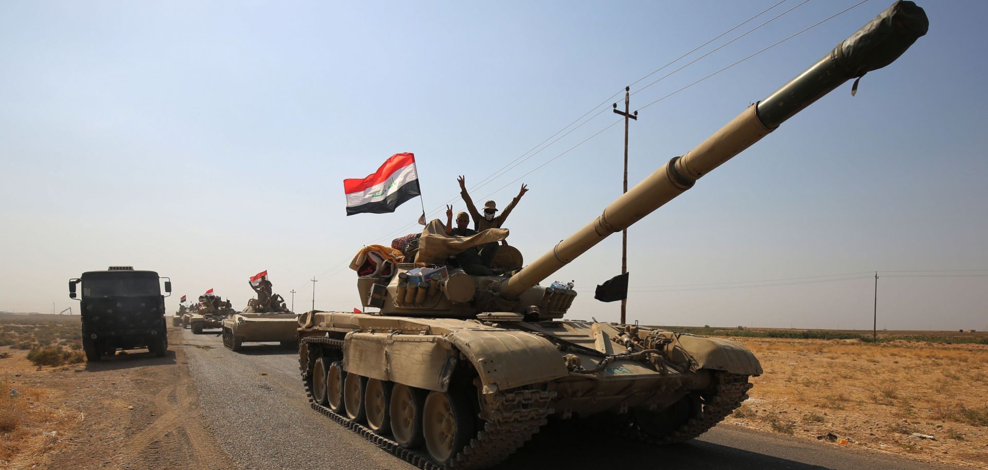 Iraqi forces drive toward peshmerga positions on Oct. 15 near Kirkuk.