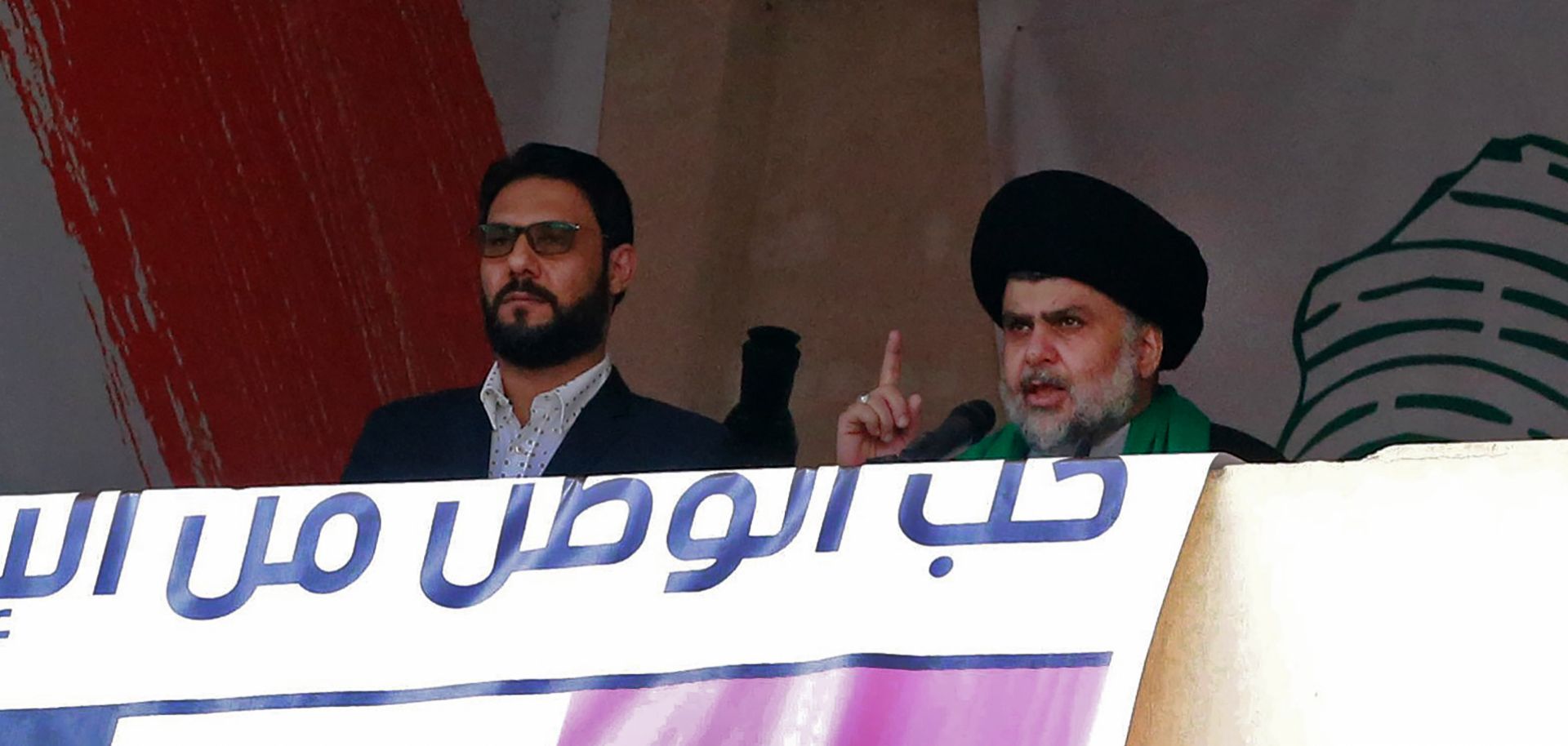 Shiite leader Muqtada al-Sadr (R) delivers a speech in Baghdad in March 2017.