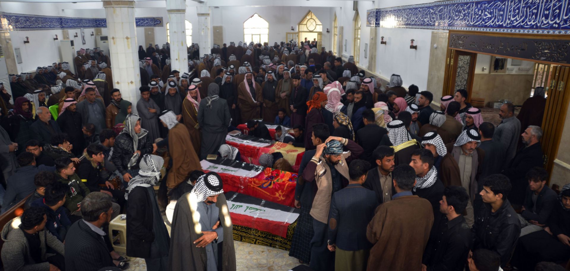Iraqis gather in a mosque in Najaf on Feb. 20, 2019, to mourn victims who were reportedly abducted and killed by armed men on motorbikes.