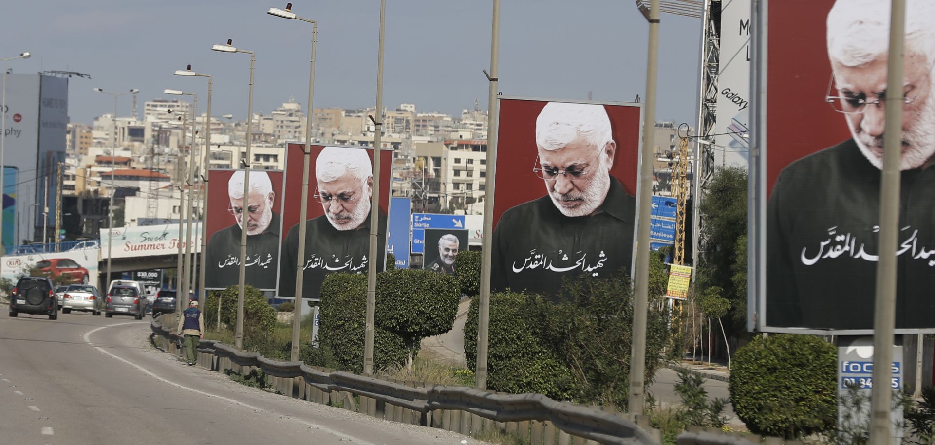 A picture taken on Jan. 11, 2020, shows portraits of Iraq's slain Popular Mobilization Unit deputy chief Abu Mahdi al-Muhandis, the late founder of Kataib Hezbollah, on the southern exit of the Lebanese capital Beirut.