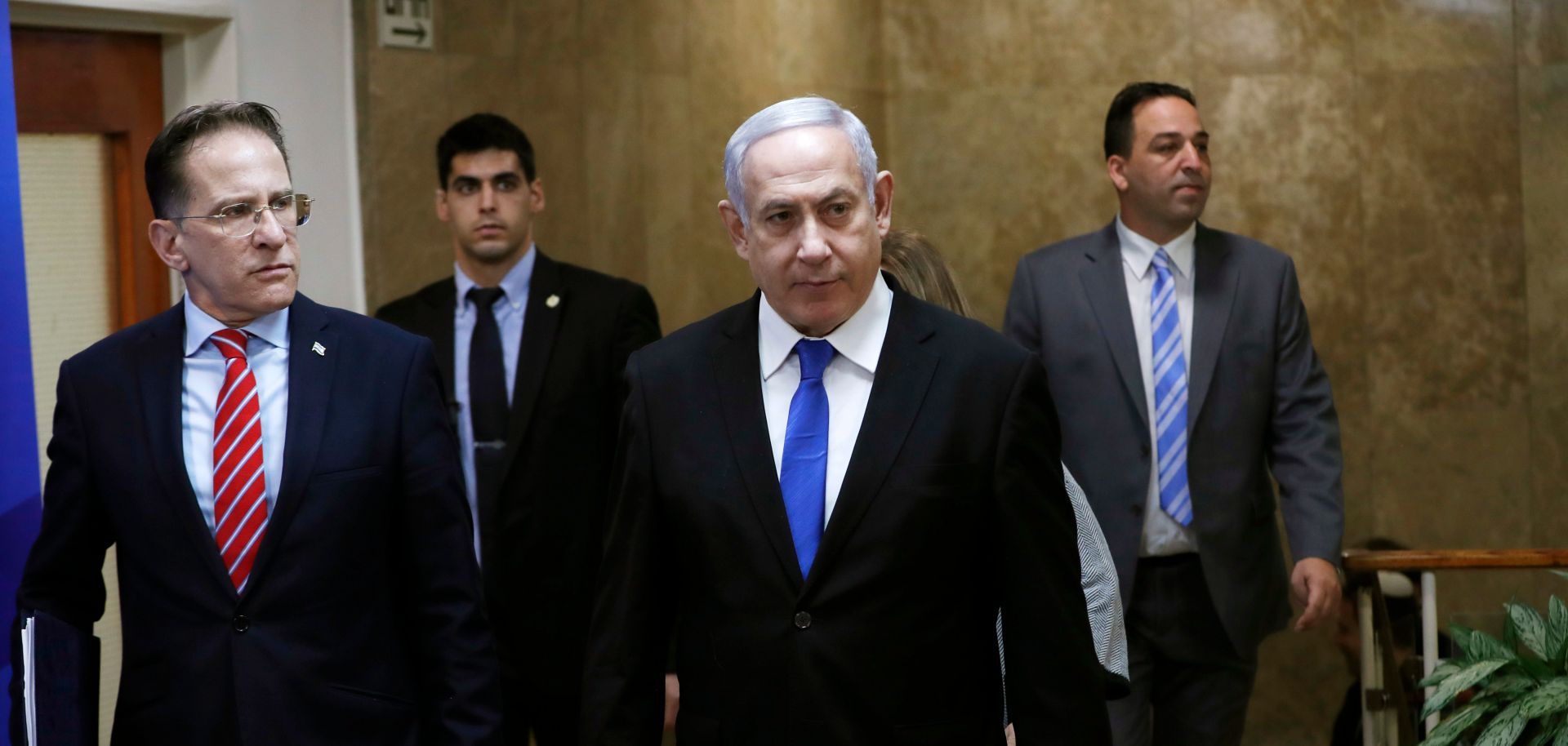 Israeli Prime Minister Benjamin Netanyahu (C) arrives at a weekly Cabinet meeting in Jerusalem on Dec. 8, 2019.