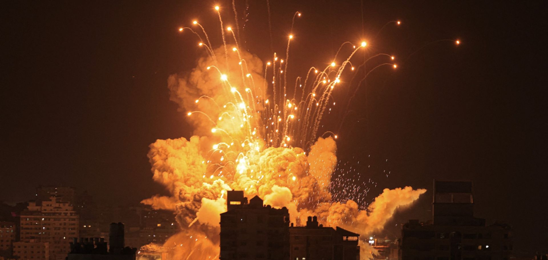 A missile explodes over Gaza City during an Israeli air strike on Oct. 8, 2023. 