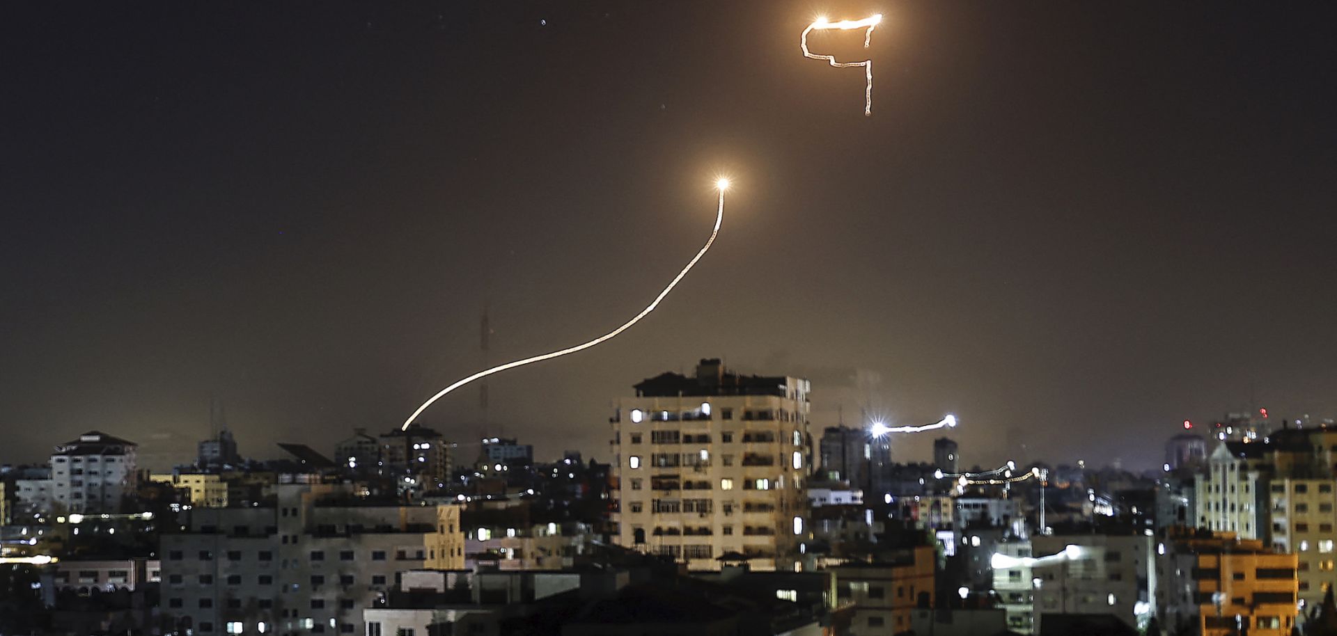 A streak of light appears as Israel's Iron Dome anti-missile system intercepts rockets on May 16, 2021, launched from the Gaza Strip.