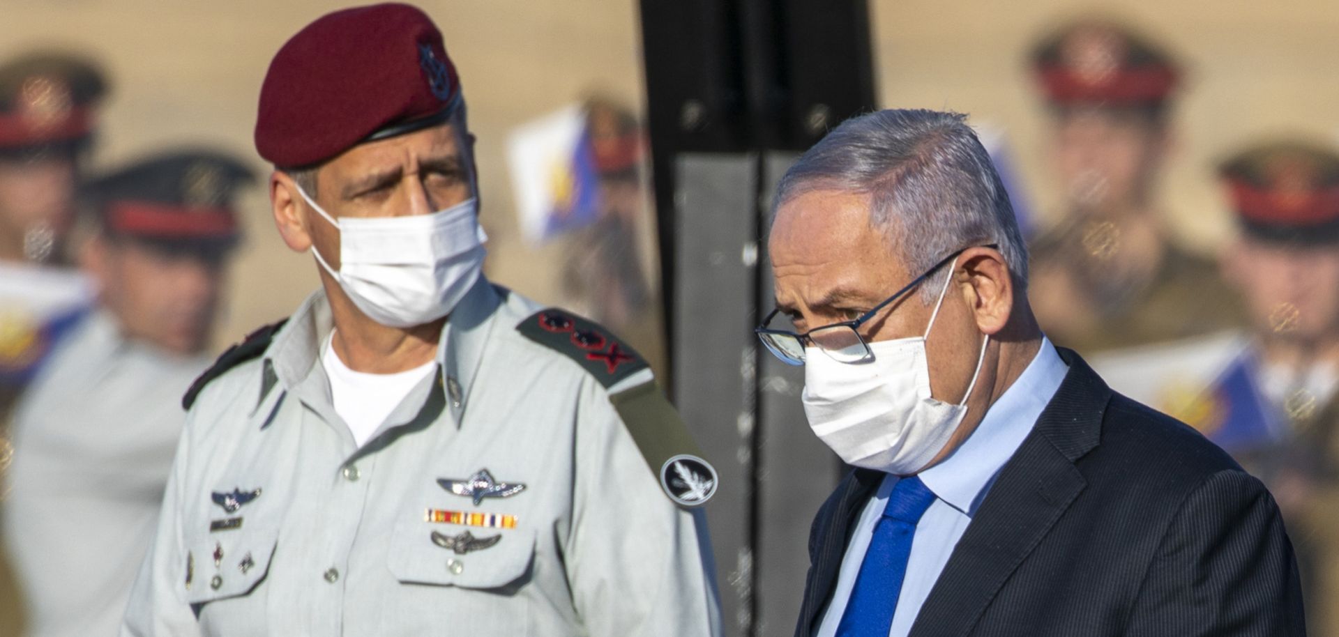 Israeli Prime Minister Benjamin Netanyahu (right) and military chief Lt. Gen. Aviv Kochavi attend a graduation ceremony for new pilots at an air force base near the southern Israeli city of Beersheba on June 25, 2020. 