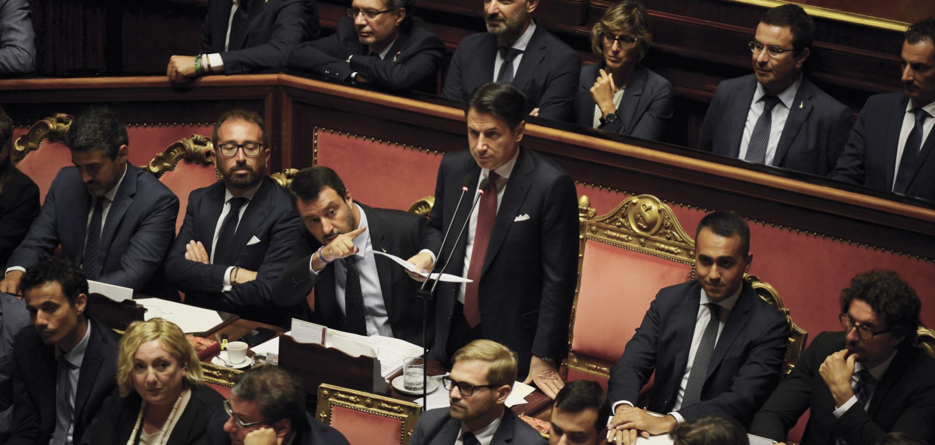 Italian Prime Minister Giuseppe Conte announces his resignation in the country's Senate on Aug. 20, 2019, as Deputy Prime Minister Matteo Salvini gestures beside him.