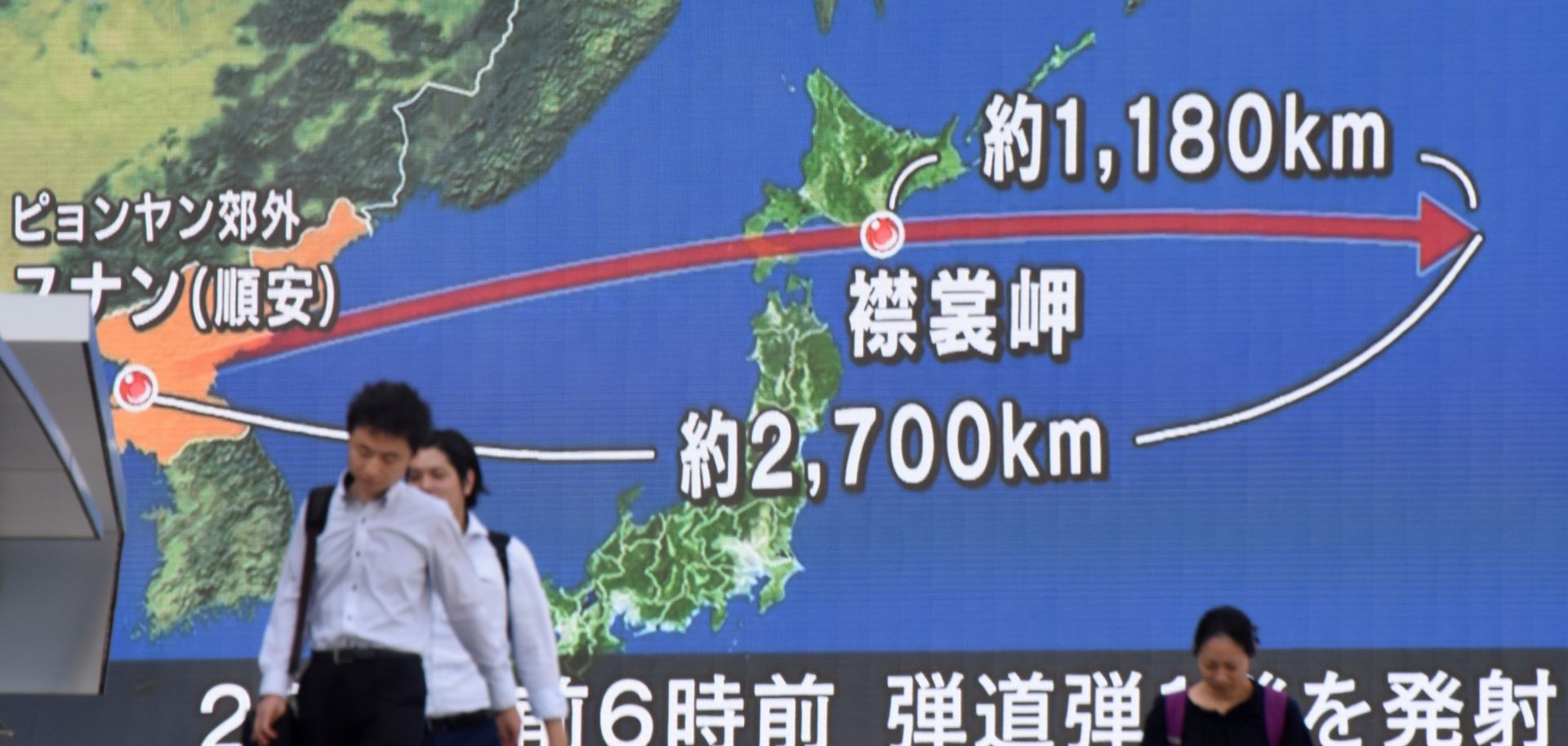 A huge map on the street in Tokyo shows the course and distance of a North Korean missile that flew over Japan in a test launch in 2017.