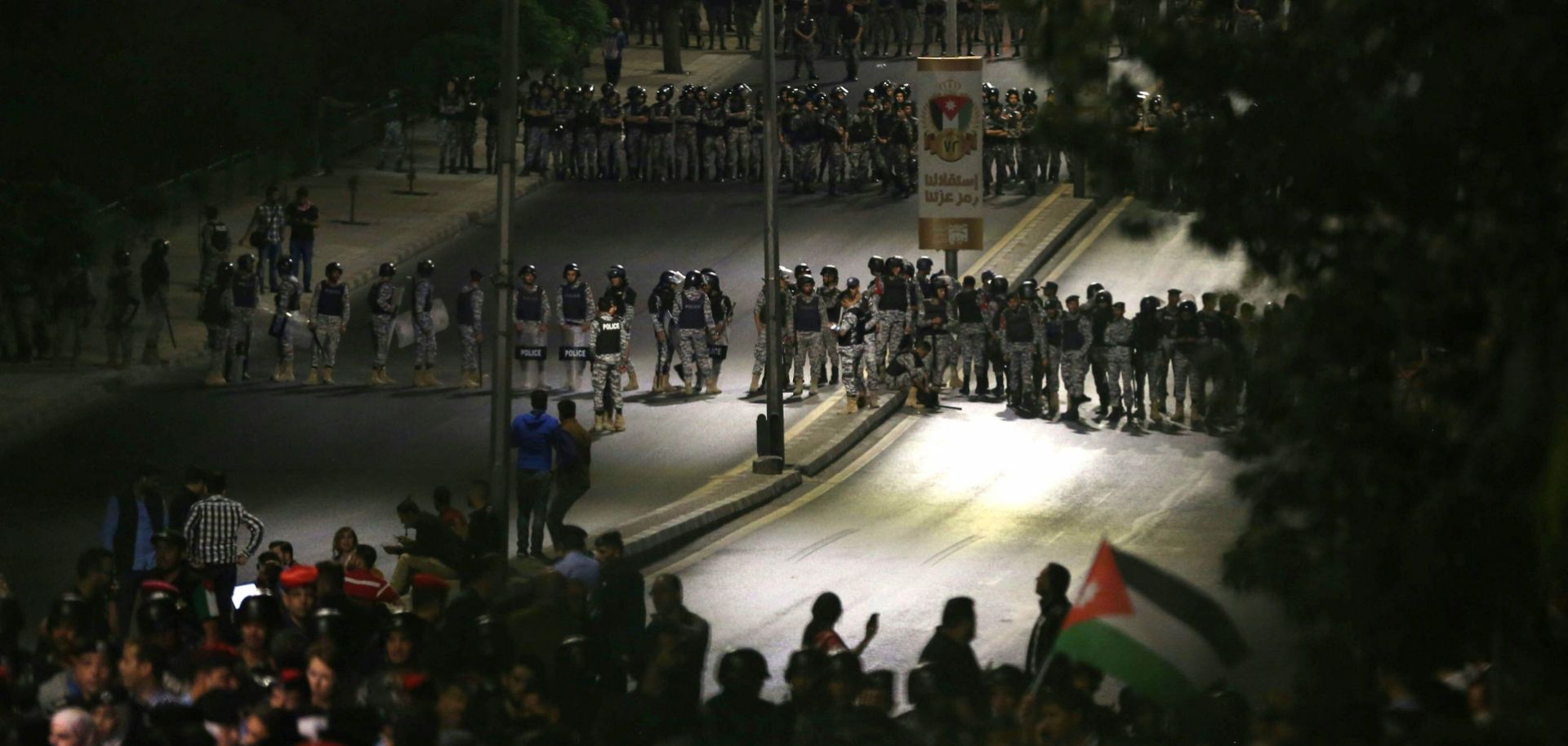 Jordanian police officers secure the office of the prime minister during a demonstration in the capital Amman late on June 4, 2018. Jordanian Prime Minister Hani Mulki resigned on June 4 after a wave of anti-austerity protests by citizens suffering from high unemployment and repeated price hikes.