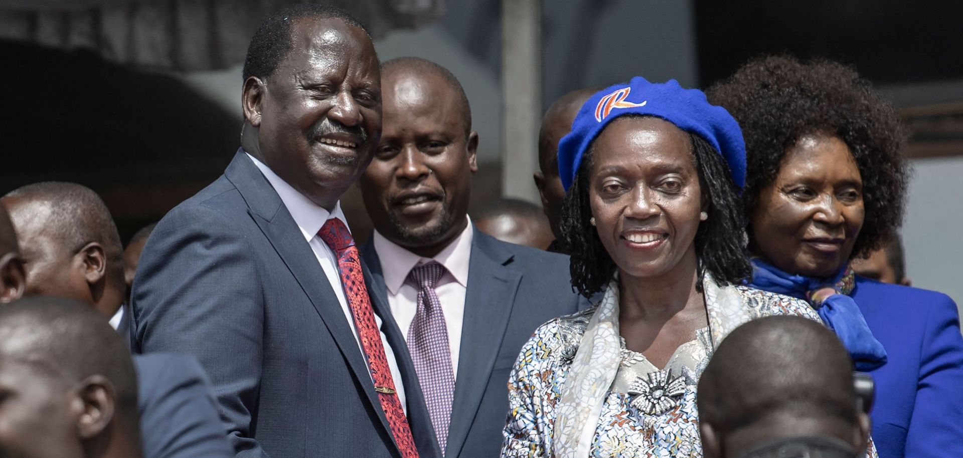 Raila Odinga (center left) shakes the hand of his newly announced running mate, Martha Karua, (center right), on May 16, 2022, in the Kenyan capital of Nairobi.