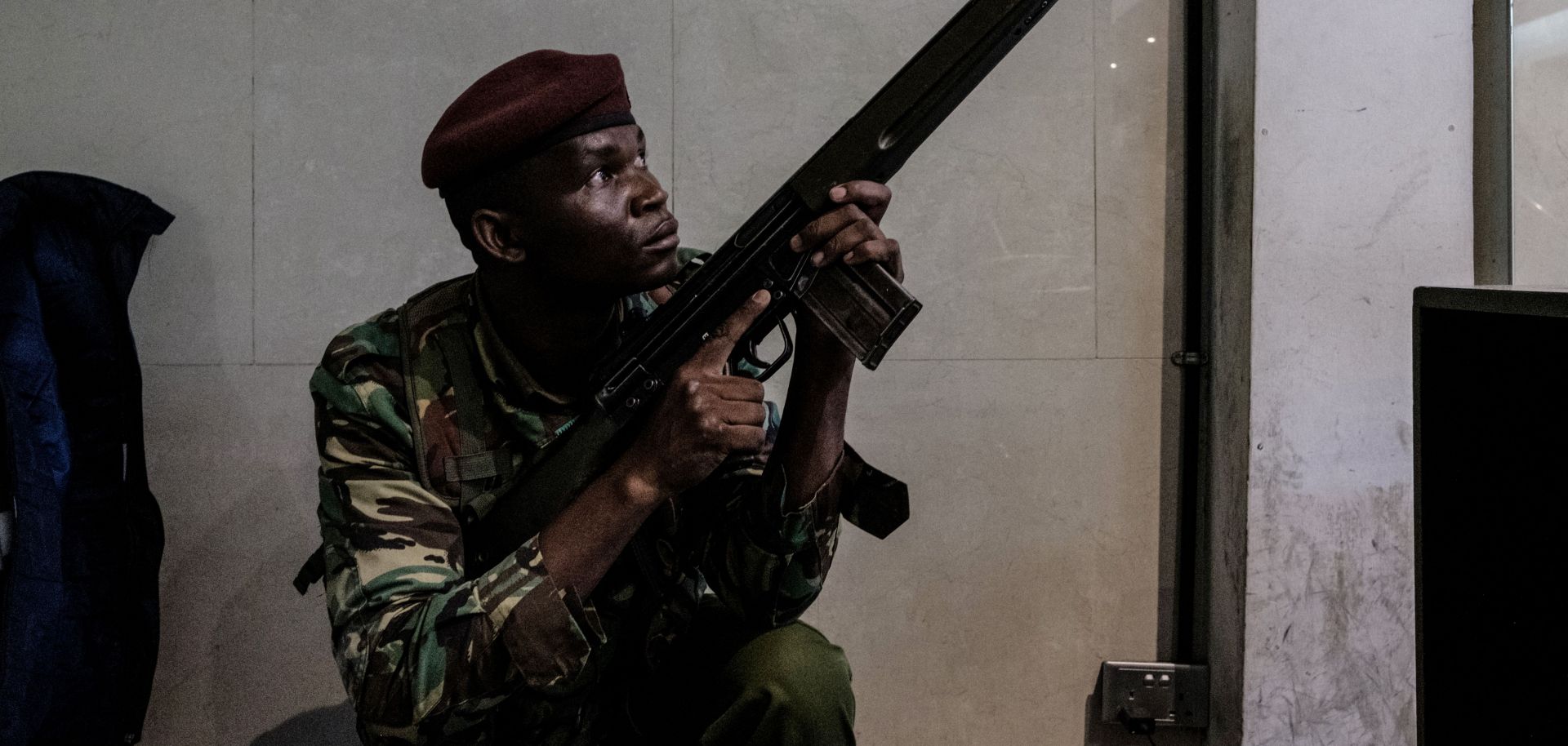 A Kenyan security officer secures a building attached to the Dusit D2 compound in Nairobi after a prolonged gun battle rocked the upmarket hotel complex, Jan. 15. 