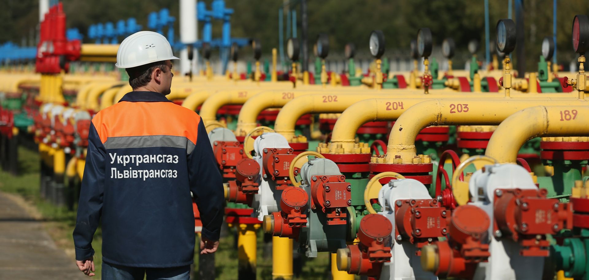 A worker walks among pipes and valves at the Dashava natural gas facility on September 18, 2014 in Dashava, Ukraine.