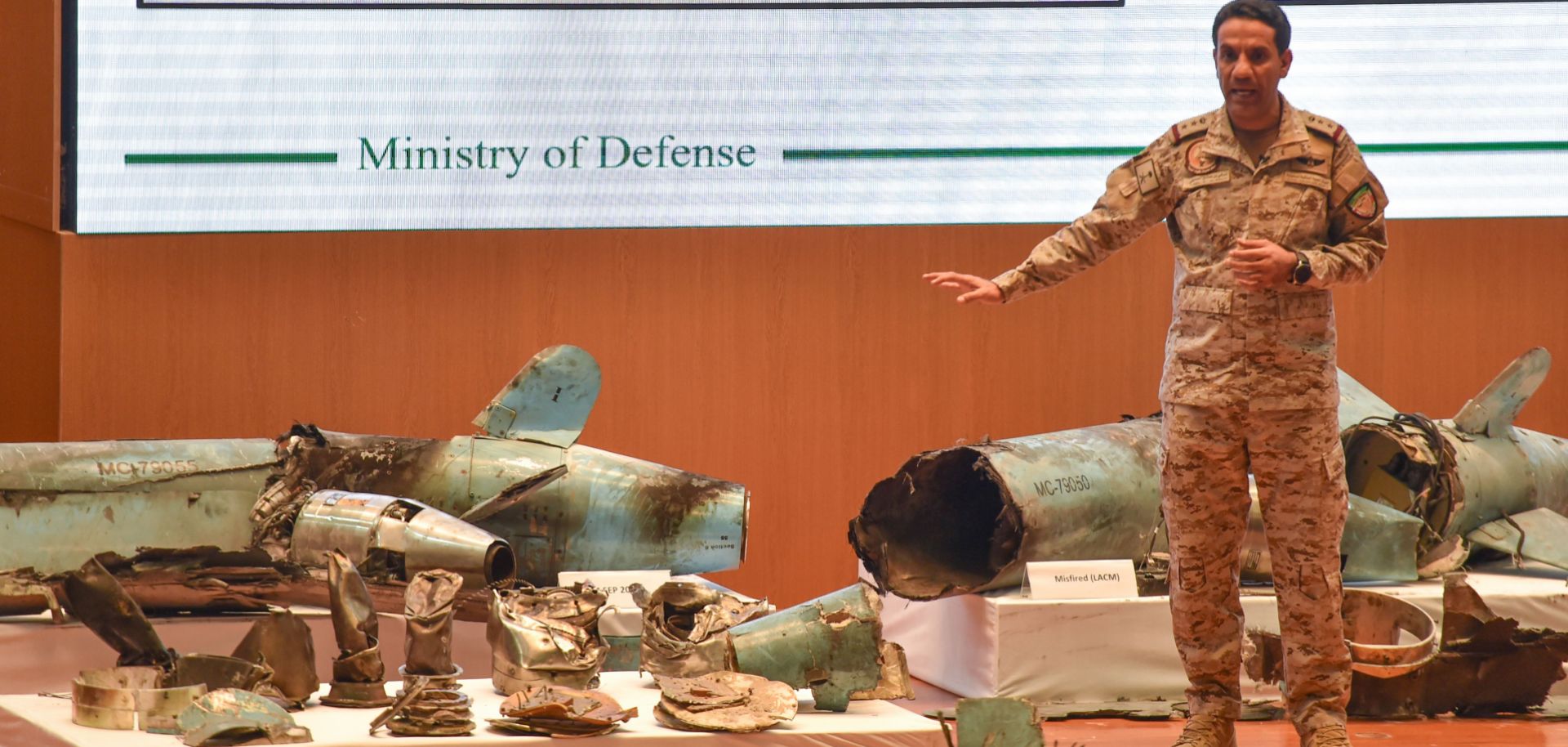 Saudi Defense Ministry spokesman Col. Turki al-Malki displays pieces of what he said were Iranian cruise missiles and drones recovered from an attack on Saudi oil facilities, during a press conference in Riyadh on Sept. 18, 2019.